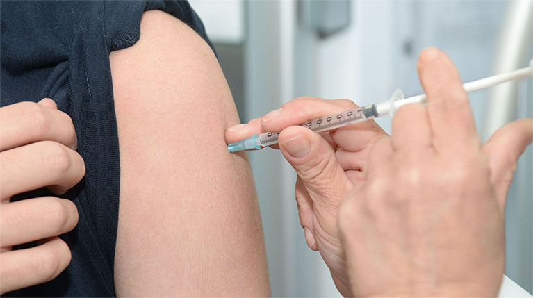 Employee receiving onsite flu vaccine shot